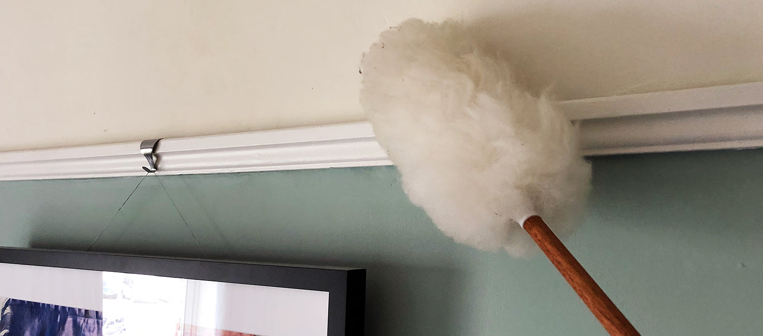 Dusting ceiling with tickling stick