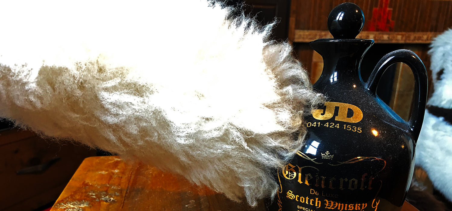 Dusting delicate items with sheepskin duster